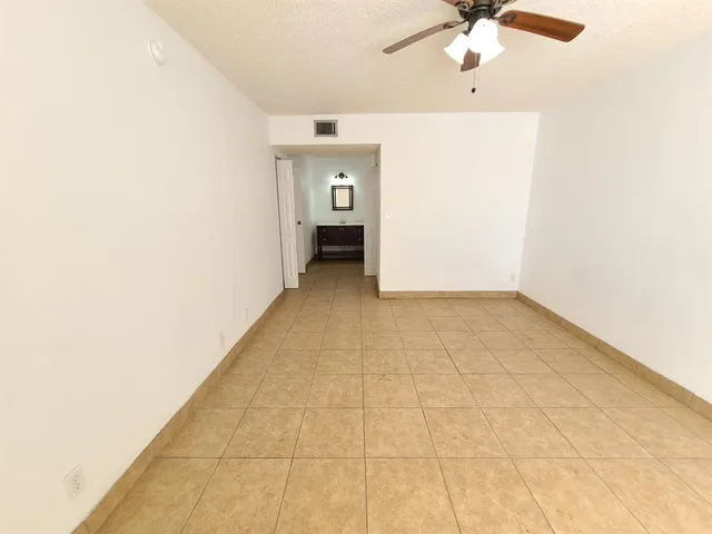 an empty room with fan