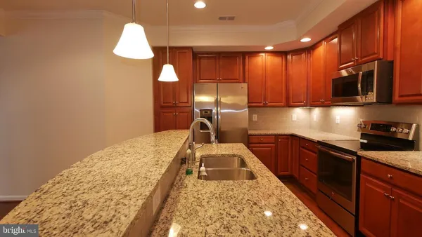 a kitchen with a sink and a stove