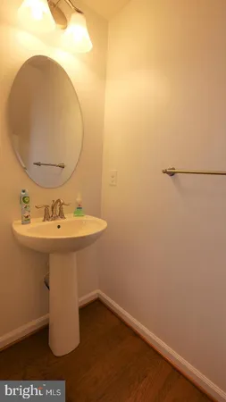 a bathroom with a sink and mirror