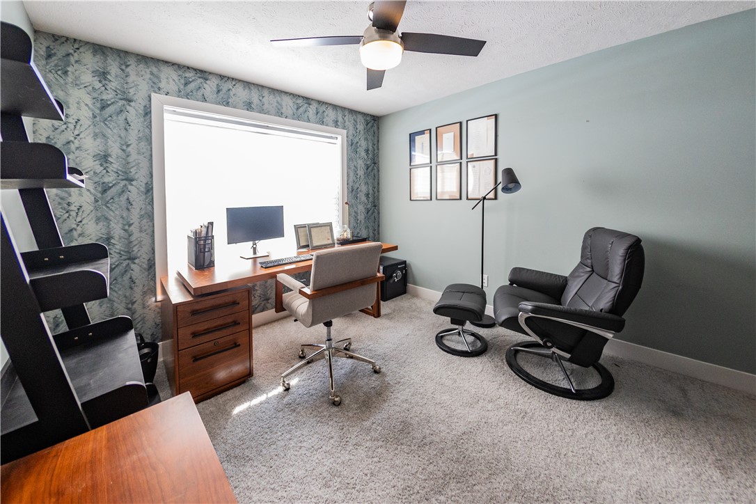 908 Declaration Drive Savoy, IL 61874 - Photo 7 of 41 a view of a workspace with furniture and a window