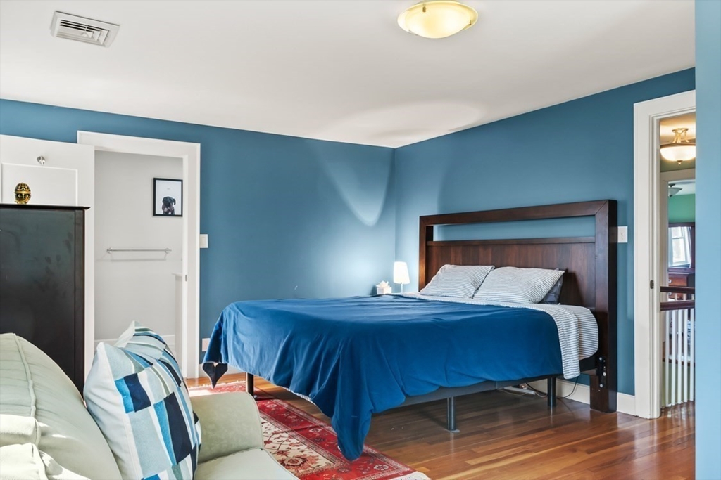 55 Wheeler Road Newton, MA 02459 - Photo 12 of 22 a bedroom with a bed and a lamp