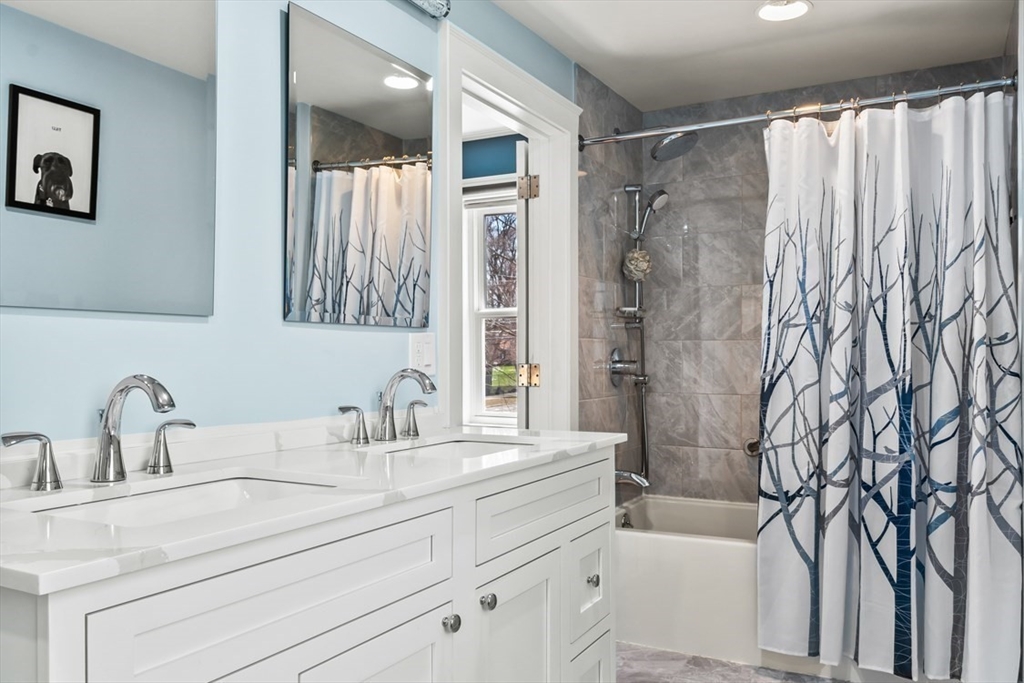 55 Wheeler Road Newton, MA 02459 - Photo 13 of 22 a bathroom with a sink and a mirror