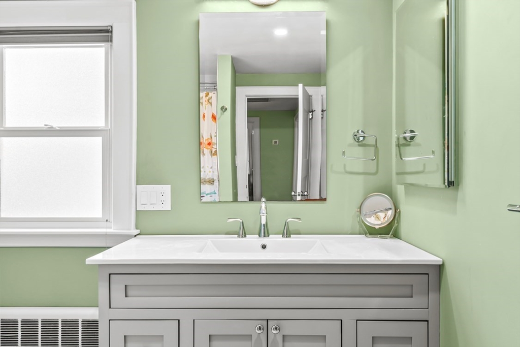 55 Wheeler Road Newton, MA 02459 - Photo 15 of 22 a bathroom with a sink and a mirror