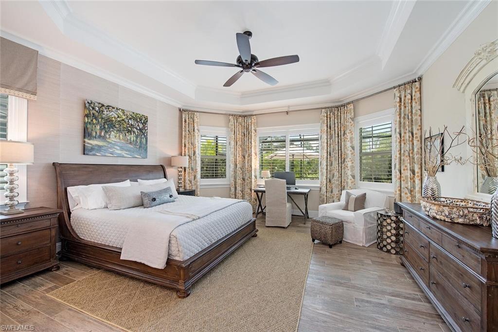 5098 Andros Drive Naples, FL 34113 - Photo 11 of 22 a bedroom with a bed and a couch