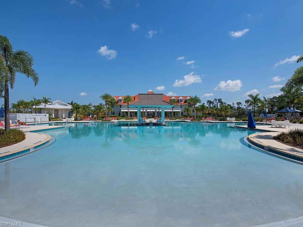 5098 Andros Drive Naples, FL 34113 - Photo 19 of 22 a view of swimming pool with outdoor seating and yard