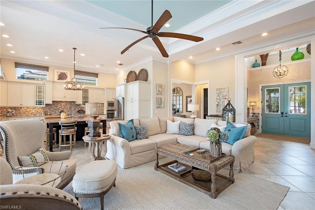 5098 Andros Drive Naples, FL 34113 - Photo 3 of 22 a living room with furniture and a view of kitchen