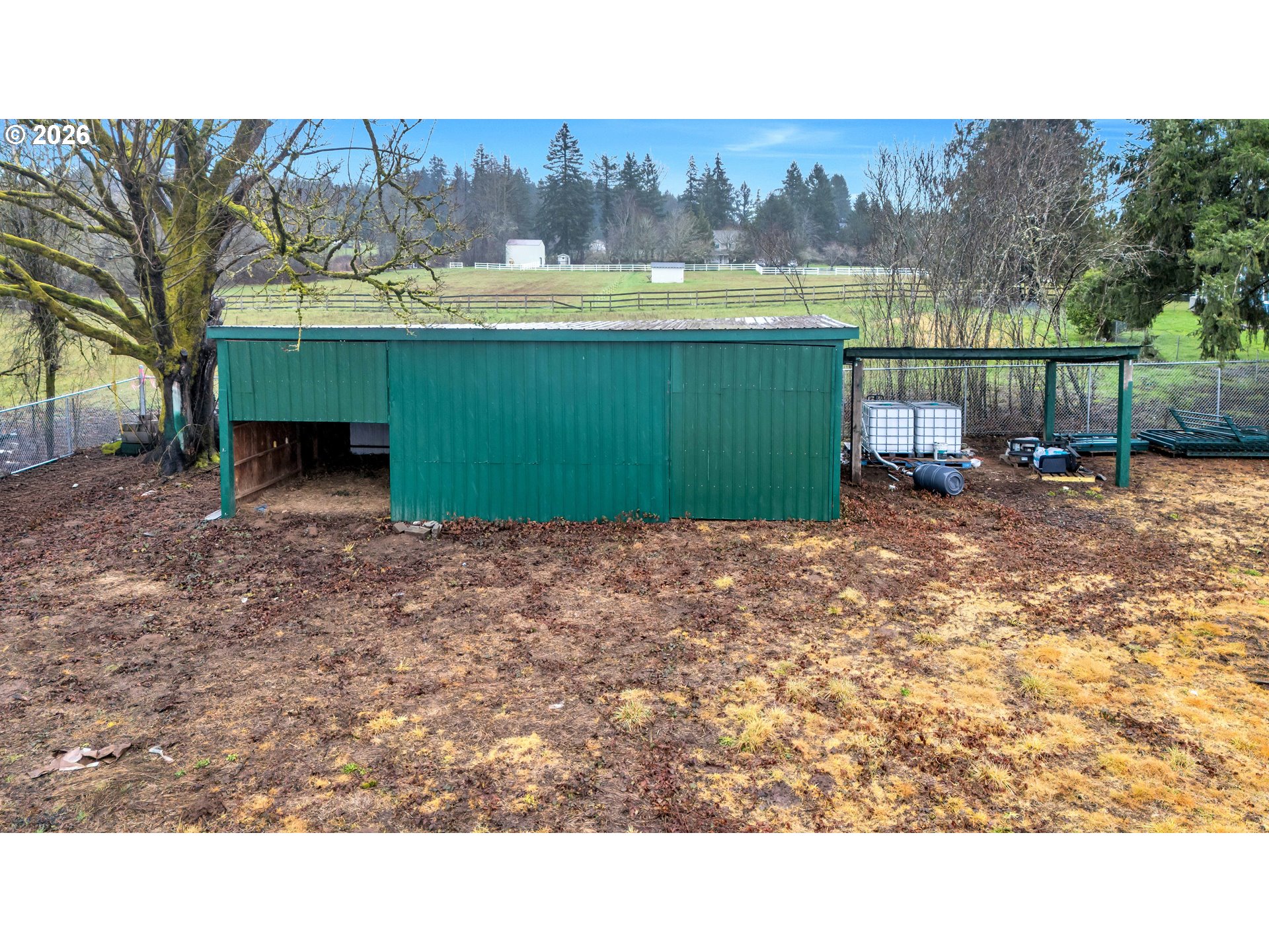 0 Northeast Ward Road Brush Prairie, WA 98606 - Photo 14 of 16 a view of a backyard with a mountain and wooden fence