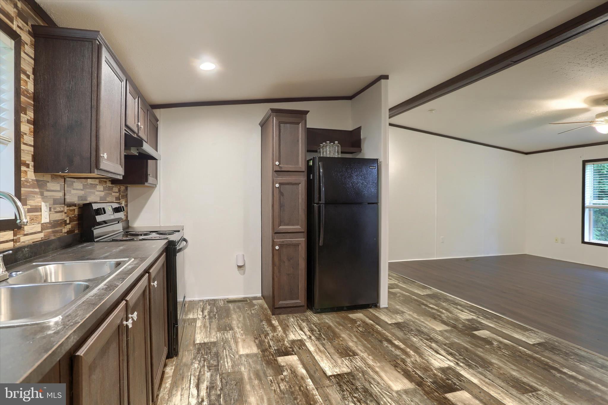 1148 Moulstown Road North Hanover, PA 17331 - Photo 10 of 29 a kitchen with a refrigerator and a sink