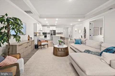 a kitchen with a sink stove and refrigerator