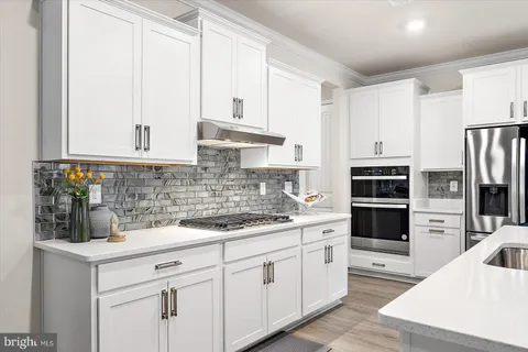 a spacious bedroom with a bed and a window