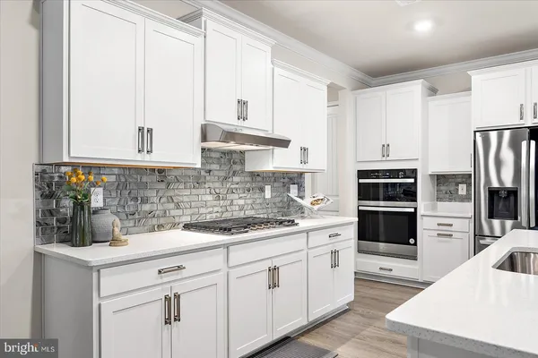 a spacious bedroom with a bed and a window