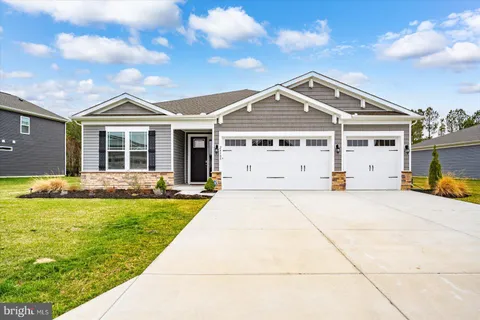 a lobby with furniture and wooden floor