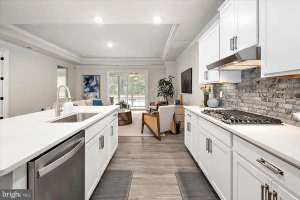a bedroom with a large bed and a potted plant