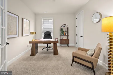 a bedroom with two beds and a chandelier