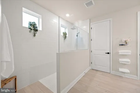 a bathroom with a toilet a sink and a mirror