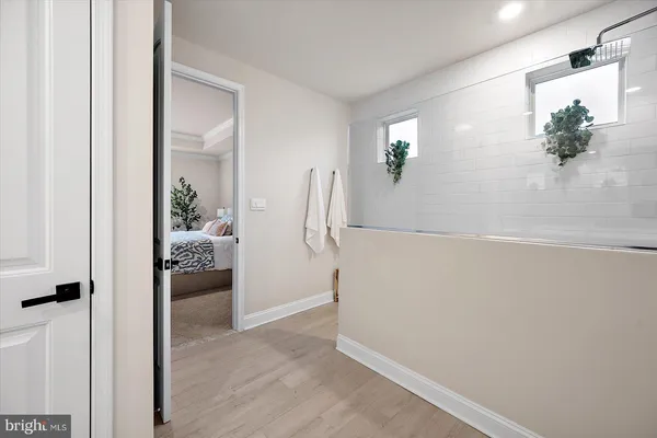 a bedroom with a bed potted plant and a window