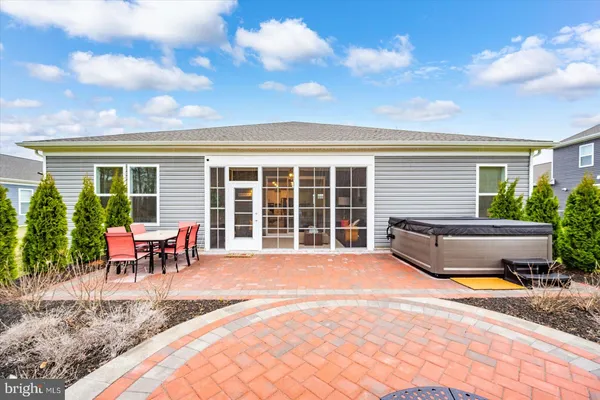 a hallway with a white stove top oven and wooden floor