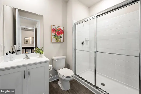 a backyard of a house with barbeque oven table and chairs