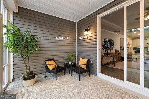 a view of a house with pool and a yard
