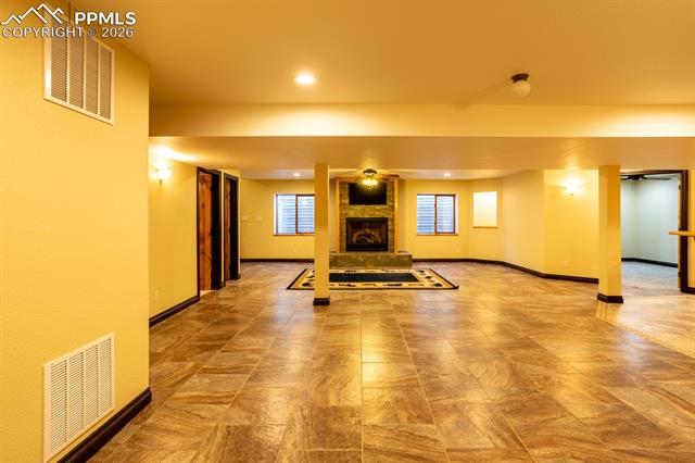 505 Cimarron Road Monument, CO 80132 - Photo 35 of 50 Basement family room, gas fireplace
