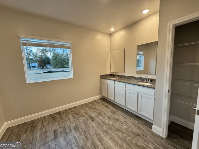 a view of kitchen with wooden floor