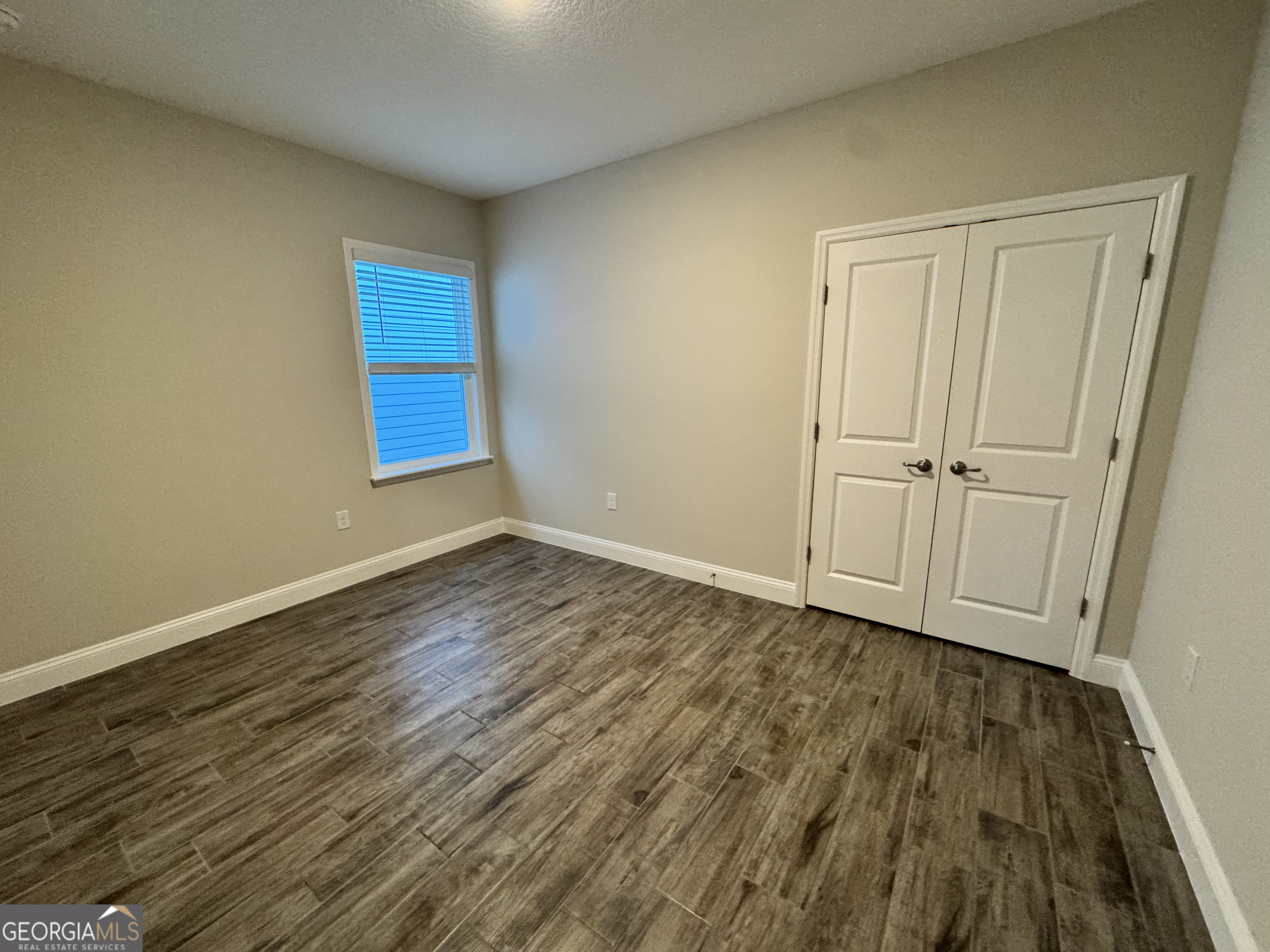 108 Brookshire Grn Court Kingsland, GA 31548 - Photo 15 of 21 a view of an empty room with wooden floor