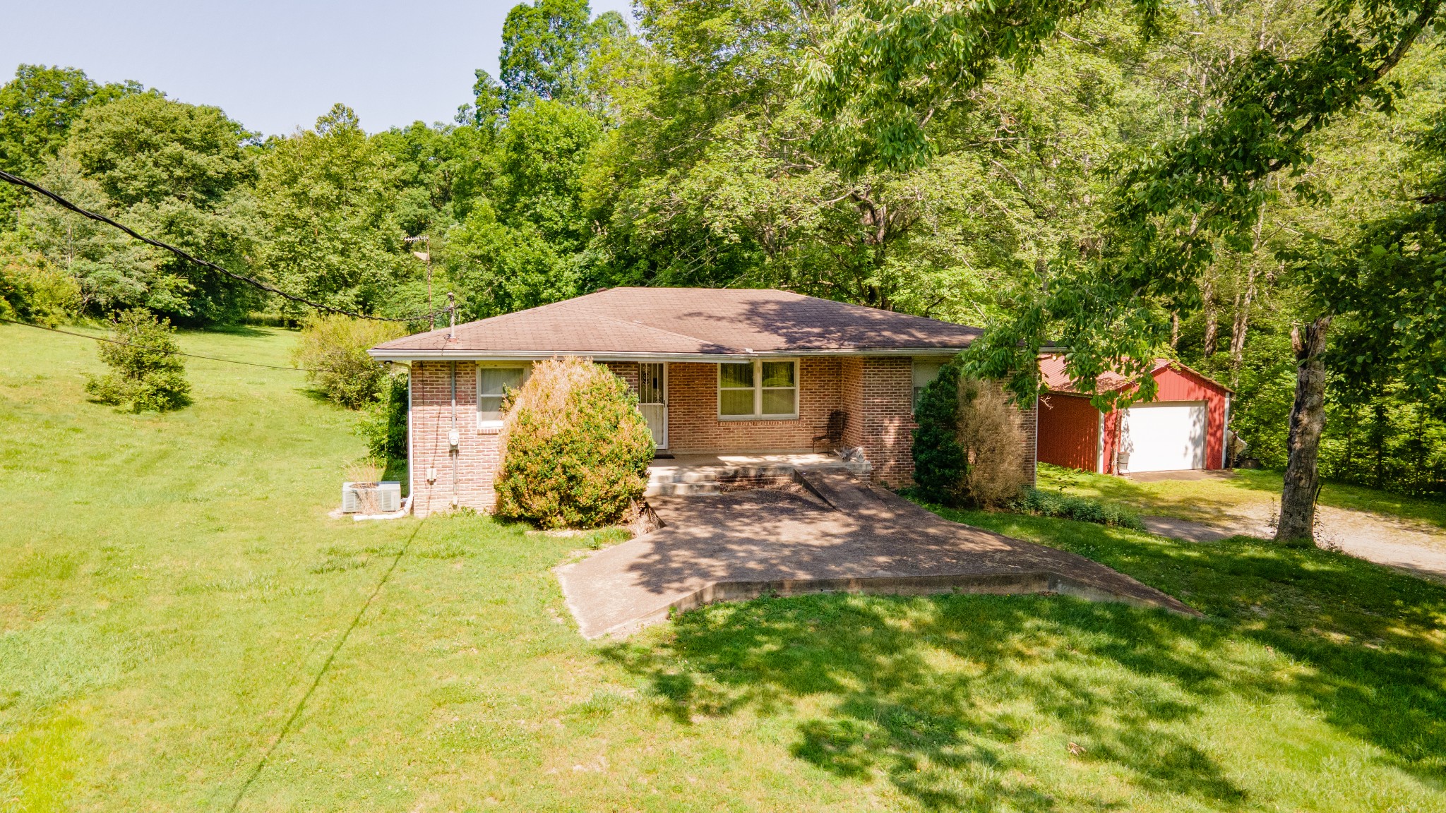7390 South Harpeth Road Franklin, TN 37064 - Photo 9 of 13 a view of a patio with table and chairs under an umbrella