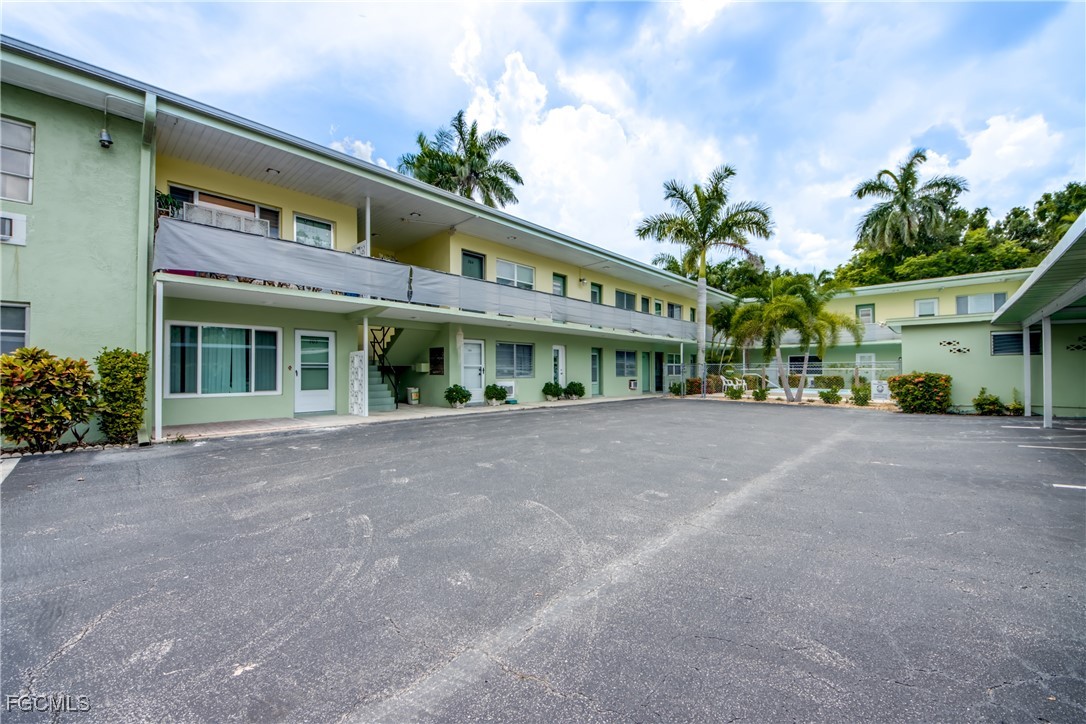 2544 First Street, Unit 107 Fort Myers, FL 33901 - Photo 3 of 35 a view of a building with a garden