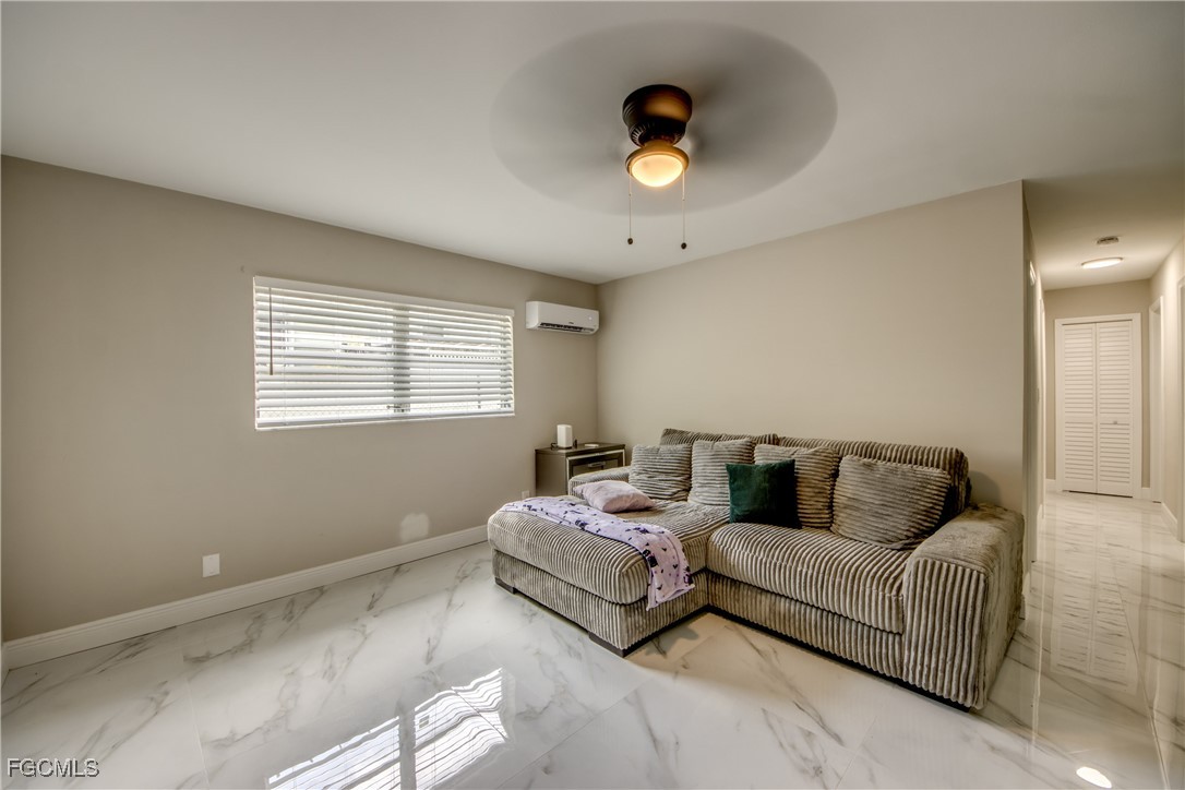 2544 First Street, Unit 107 Fort Myers, FL 33901 - Photo 6 of 35 a living room with furniture and a window