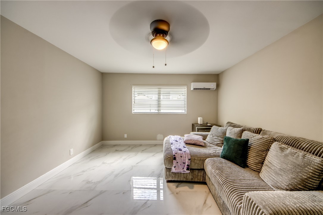 2544 First Street, Unit 107 Fort Myers, FL 33901 - Photo 7 of 35 a living room with furniture and a window