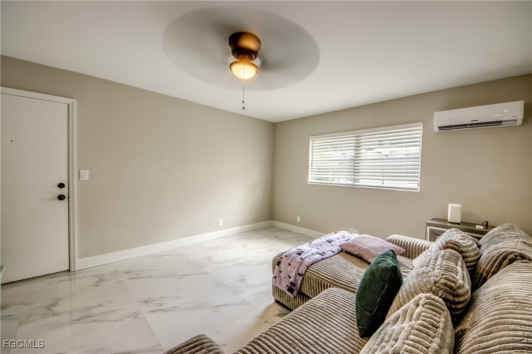 2544 First Street, Unit 107 Fort Myers, FL 33901 - Photo 8 of 35 a bedroom with a bed and a window