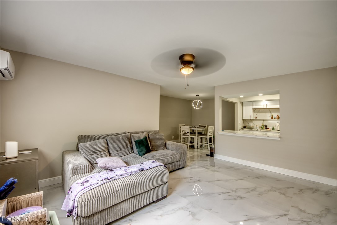 2544 First Street, Unit 107 Fort Myers, FL 33901 - Photo 9 of 35 a spacious bedroom with a bed and window