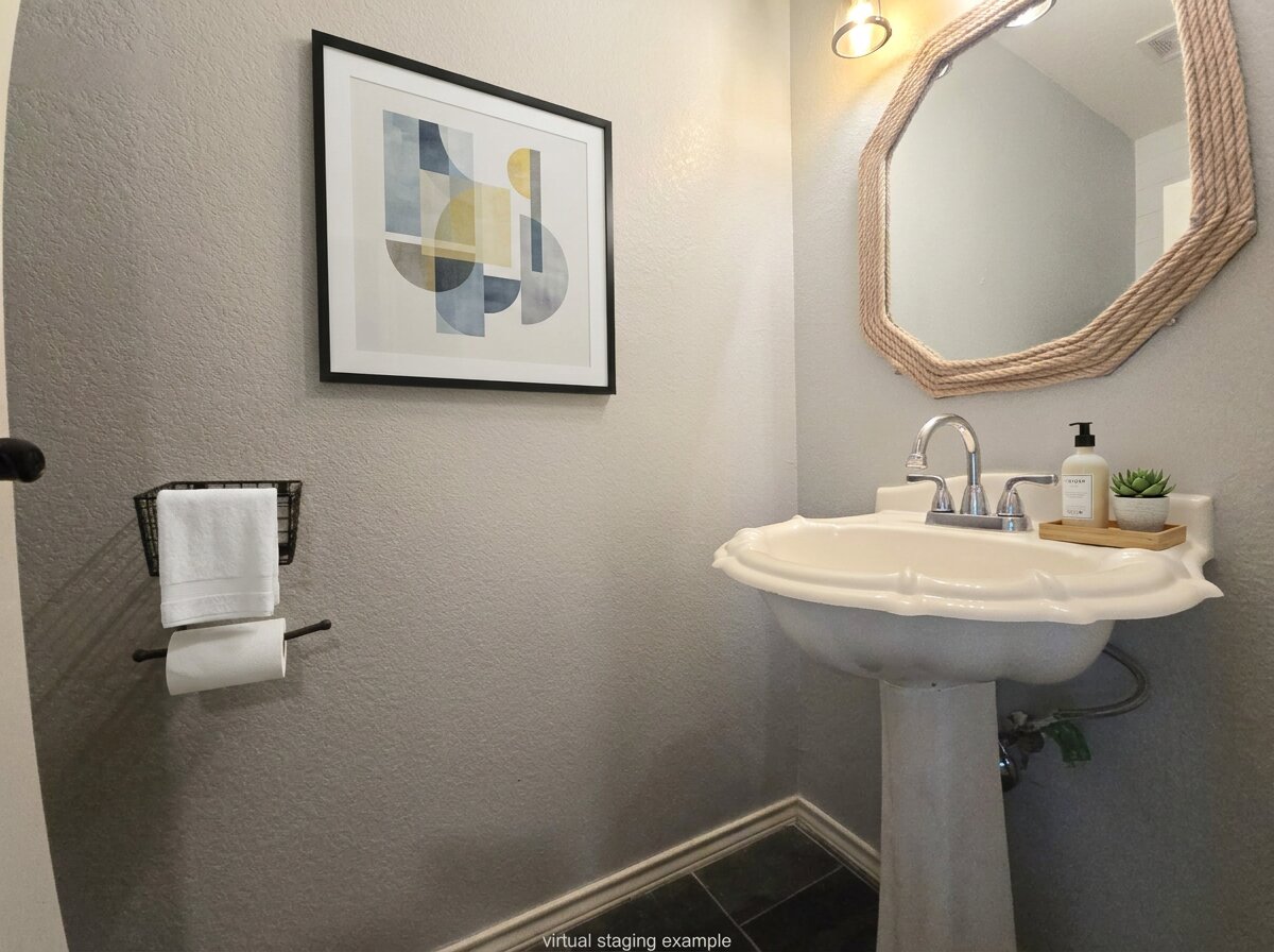 815 Bogart Road Cedar Park, TX 78613 - Photo 4 of 14 A compact and functional bathroom space featuring a classic pedestal sink and simple fixtures.