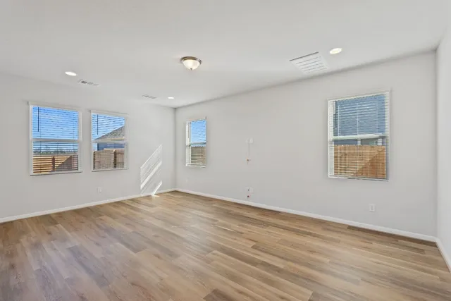 a view of kitchen and wooden floor