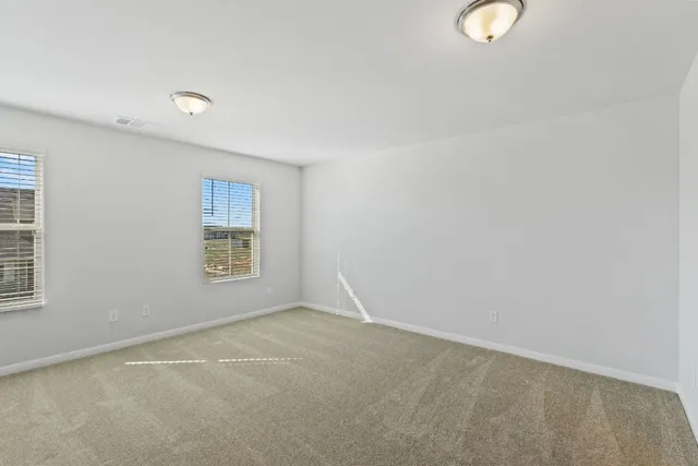 a view of kitchen with wooden floor and electronic appliances