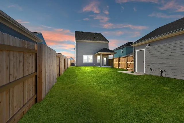 a view of a backyard with plants