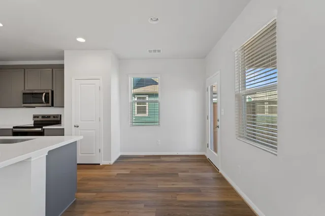 a view of a kitchen from the hallway