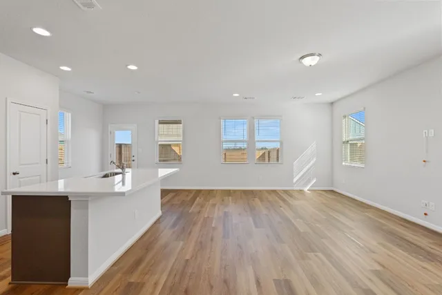 an aerial view of a house with swimming pool and ocean view
