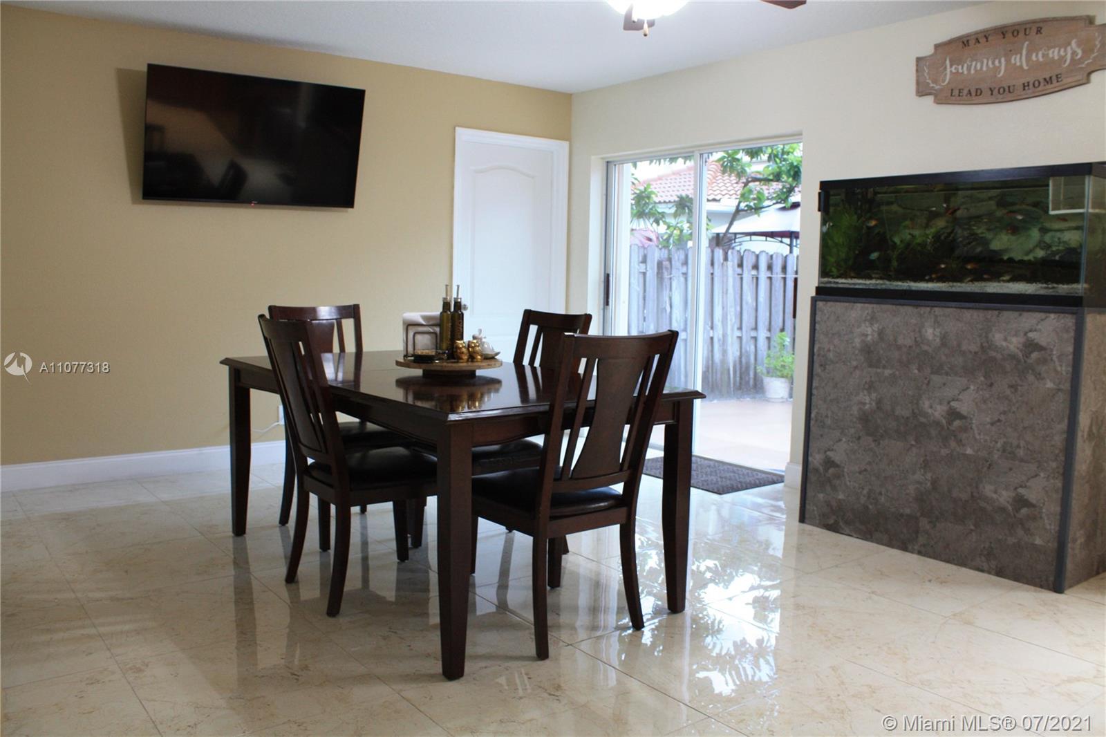 11352 Roundelay Road Cooper City, FL 33026 - Photo 11 of 30 a view of a dining room with furniture window and outside view