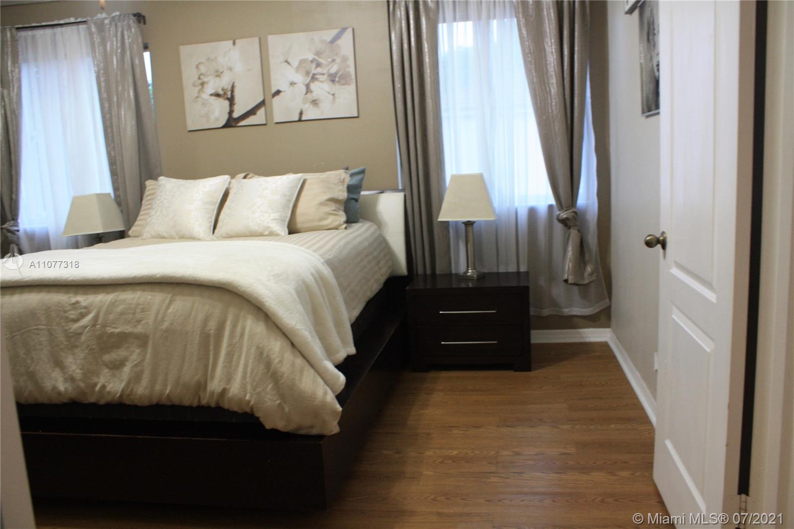11352 Roundelay Road Cooper City, FL 33026 - Photo 16 of 30 a bedroom with a bed and a window