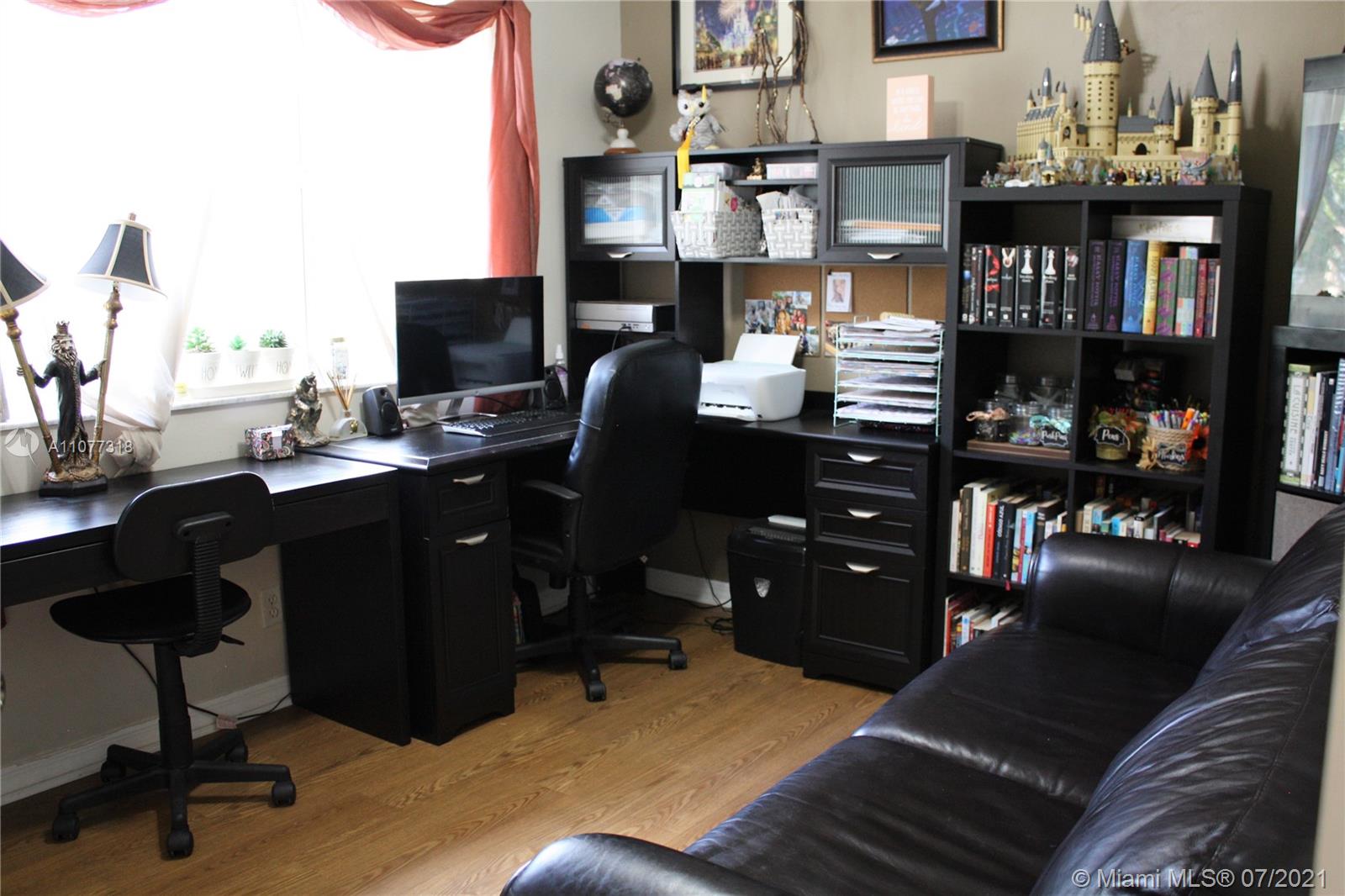 11352 Roundelay Road Cooper City, FL 33026 - Photo 19 of 30 a view of a workspace with furniture