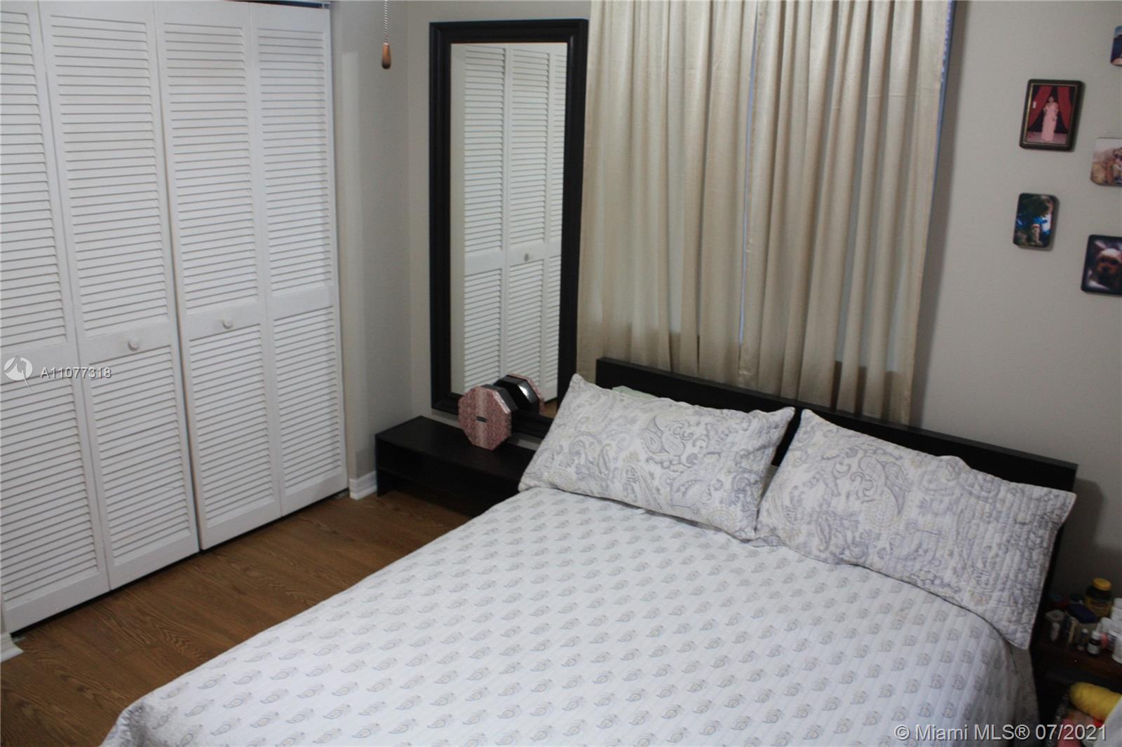 11352 Roundelay Road Cooper City, FL 33026 - Photo 23 of 30 a bedroom with a bed and a window
