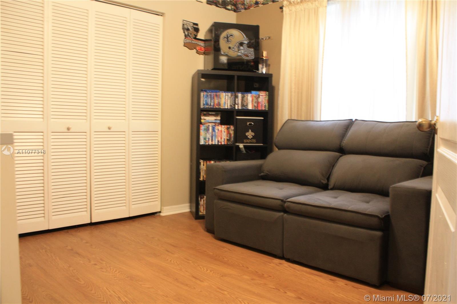 11352 Roundelay Road Cooper City, FL 33026 - Photo 25 of 30 a living room with furniture and a window