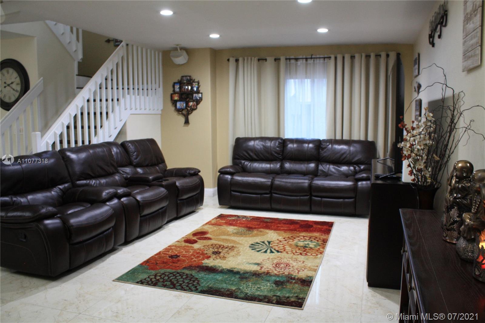 11352 Roundelay Road Cooper City, FL 33026 - Photo 4 of 30 a living room with furniture and a rug