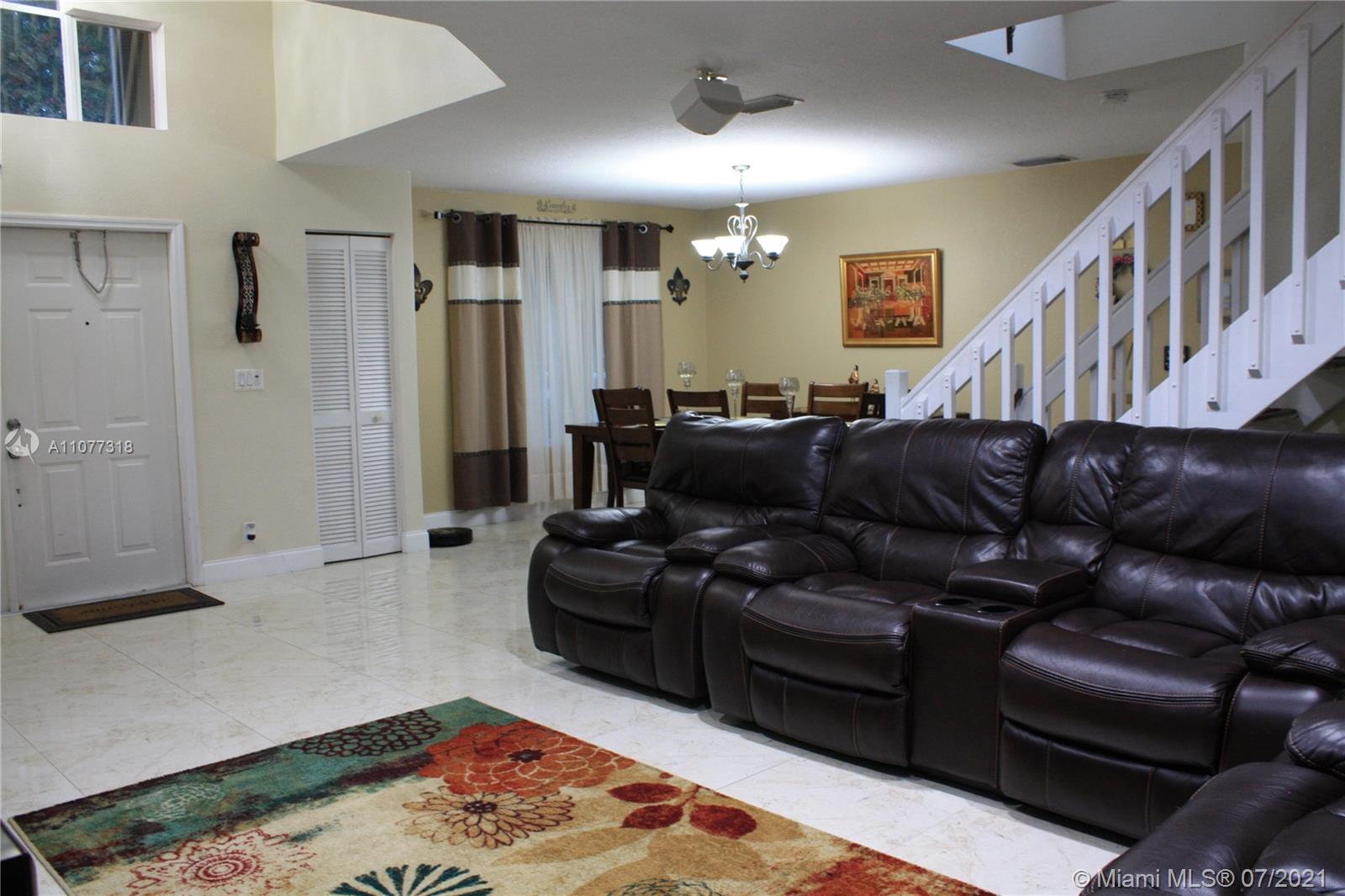 11352 Roundelay Road Cooper City, FL 33026 - Photo 7 of 30 a living room with furniture and a rug