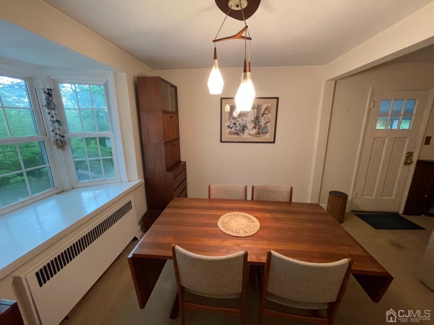 3 Lansing Place New Brunswick, NJ 08901 - Photo 13 of 29 a view of a dining room with furniture window and wooden floor