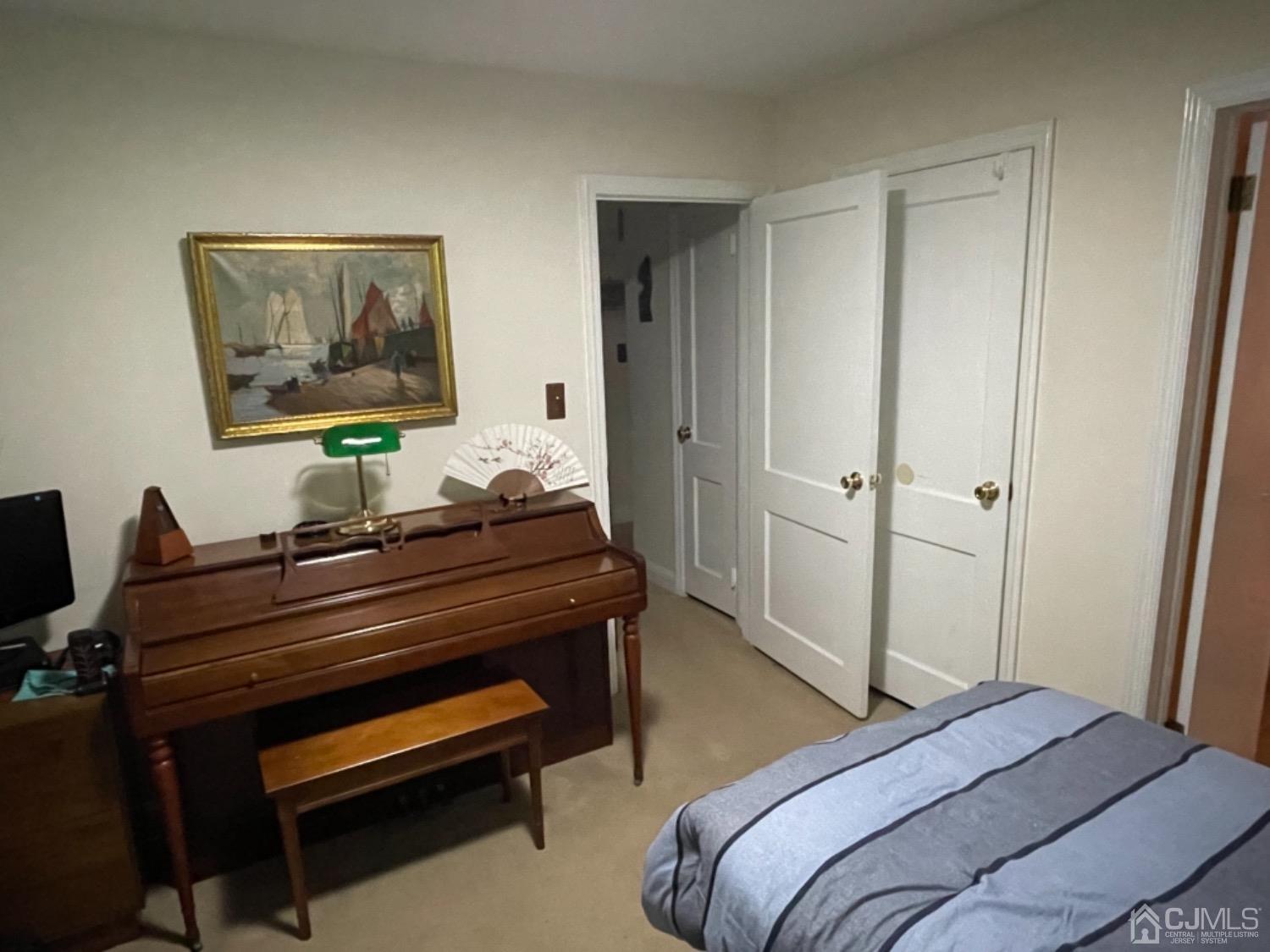 3 Lansing Place New Brunswick, NJ 08901 - Photo 23 of 29 a bedroom with a bed and a piano