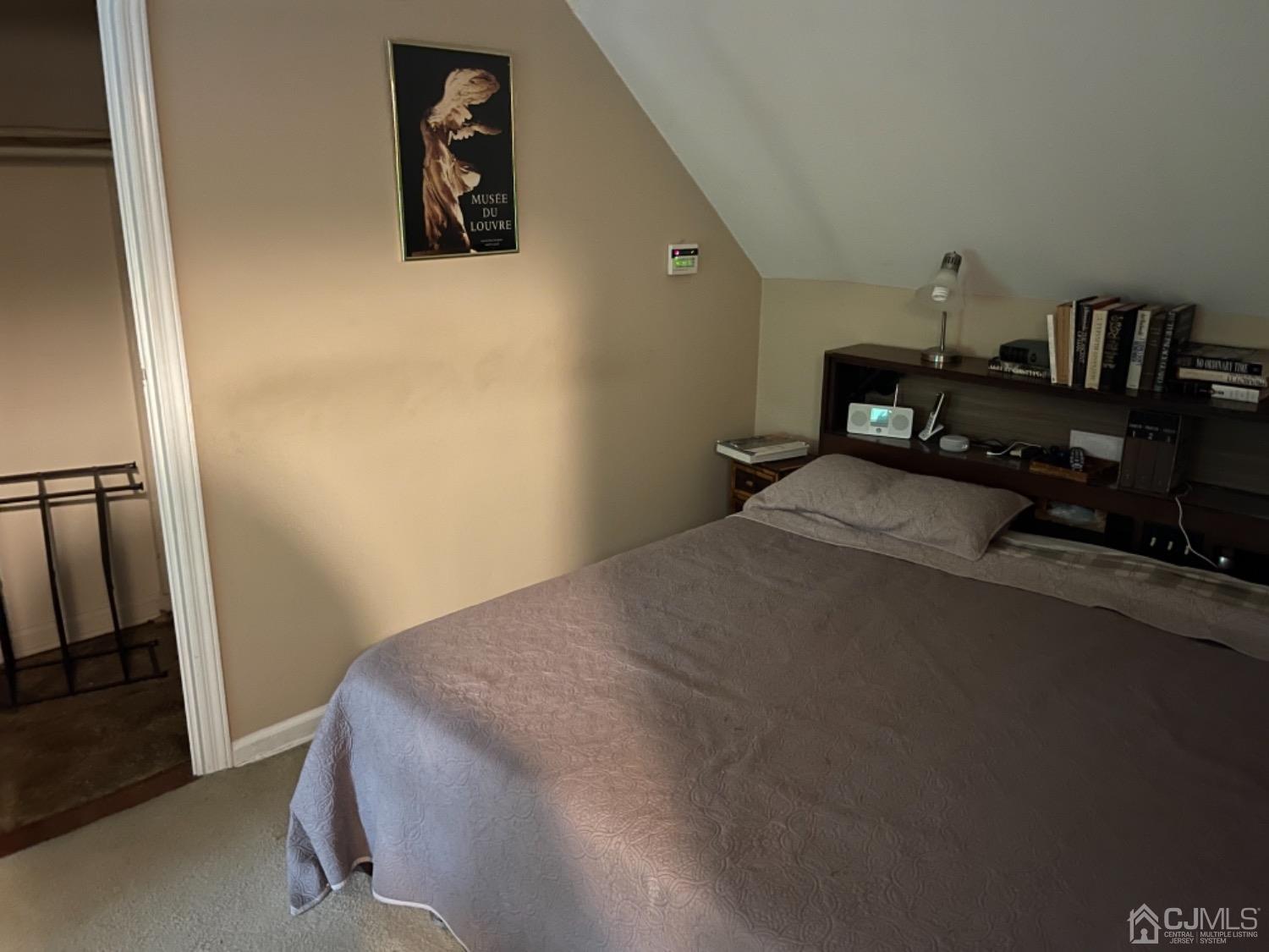 3 Lansing Place New Brunswick, NJ 08901 - Photo 9 of 29 a bedroom with a bed and wooden floor