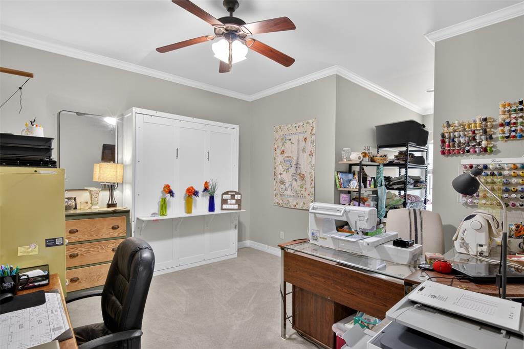 11868 Timber Ridge Drive Keithville, LA 71047 - Photo 24 of 37 Light gray wall paint, crown molding, and a ceiling fan with light fixture