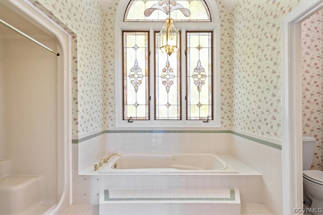 14324 Regatta Pointe Road Midlothian, VA 23112 - Photo 11 of 50 a bathroom with a bathtub and a shower